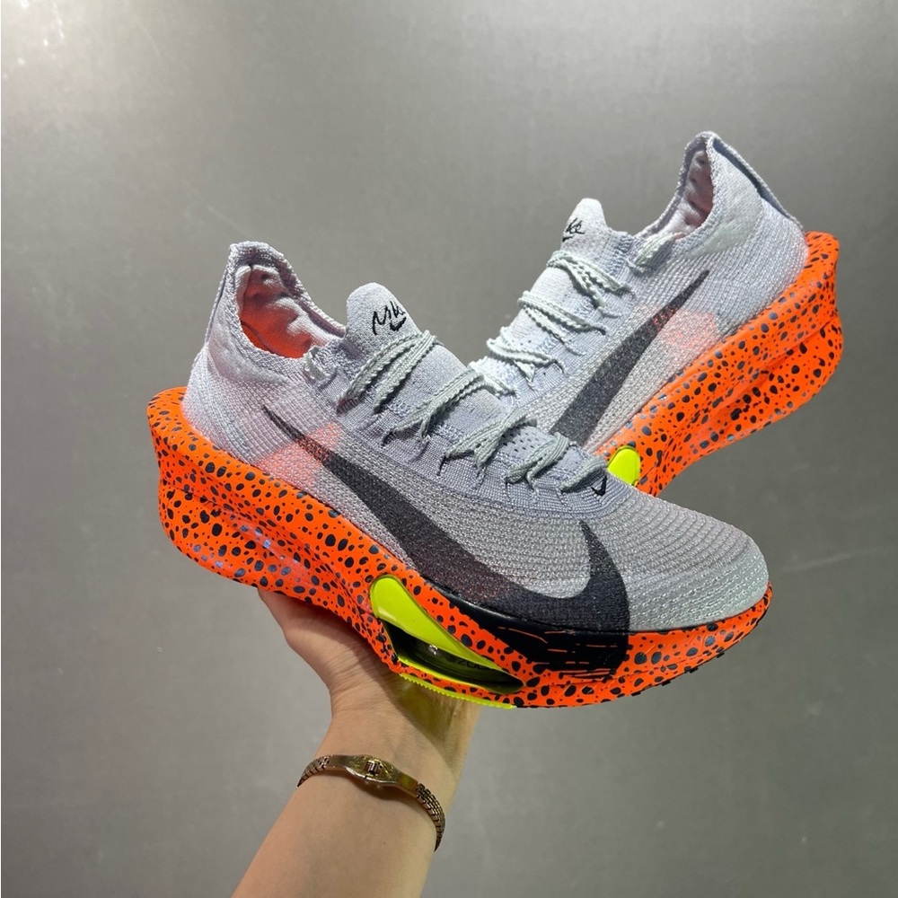 Nike Light Gray Knit Running Shoes with Bright Orange Speckled Sole